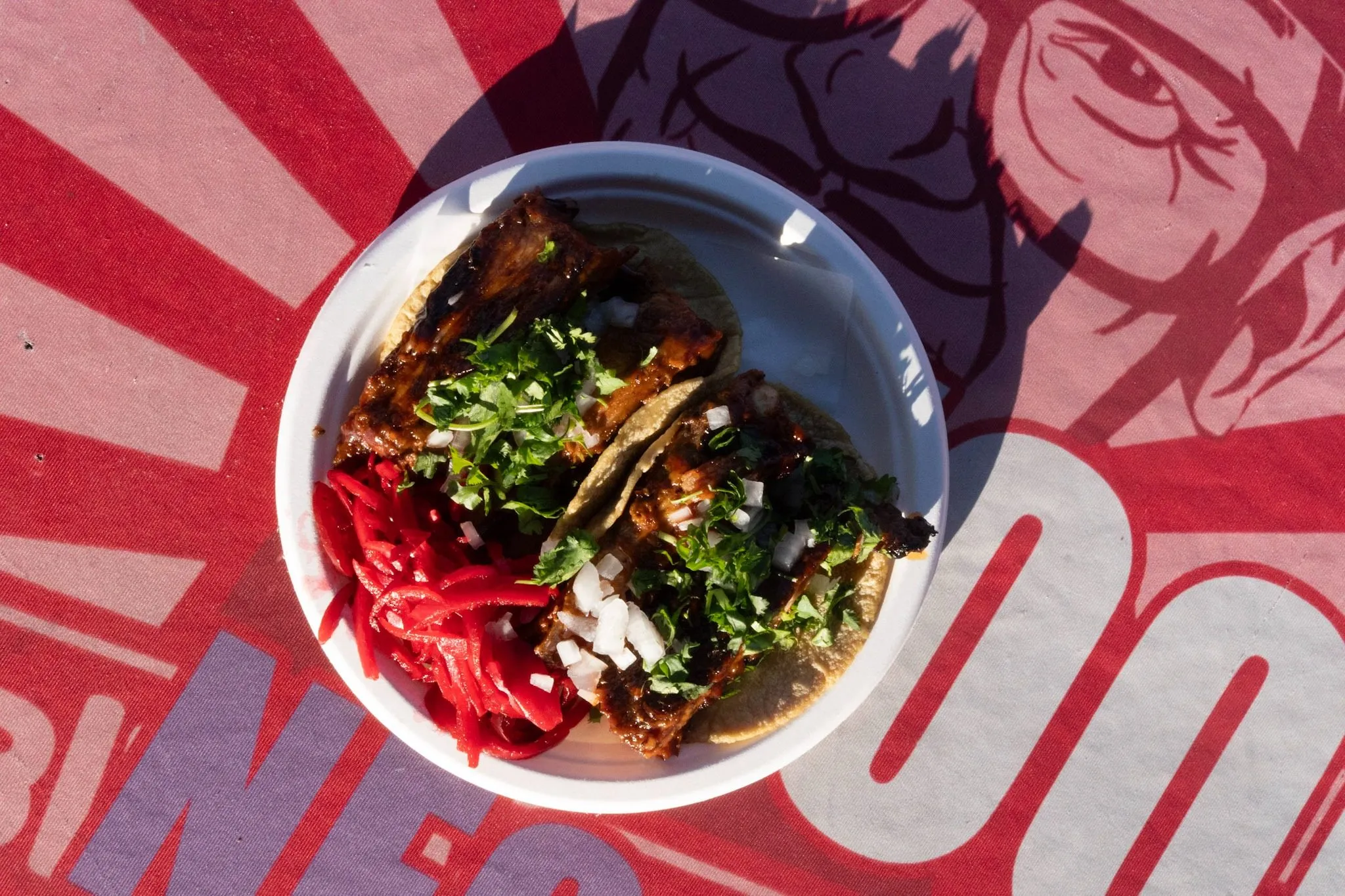 Lomo saltado plate on the red sunburst table