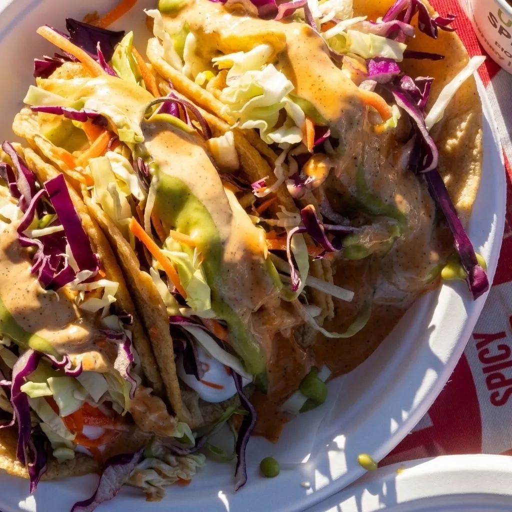 Crispy fish tacos with cabbage, avocado and creamy sauce